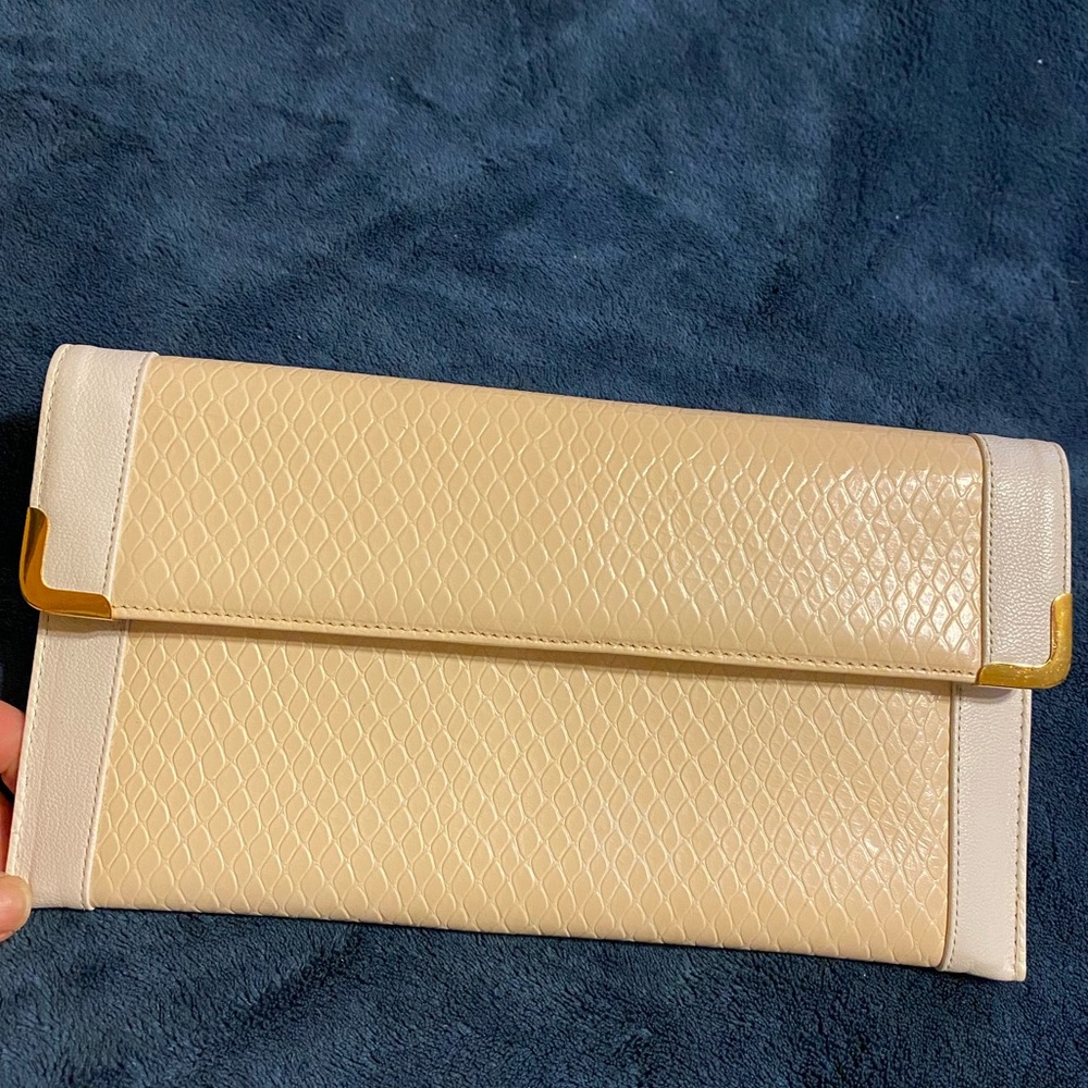 Koret white and cream leather clutch purse.